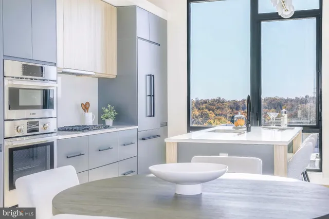 a bathroom with a toilet a sink and a mirror