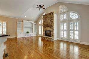 802 Pathview Court Dacula, GA 30019 - Photo 15 of 56 a view of an empty room with wooden floor and a window
