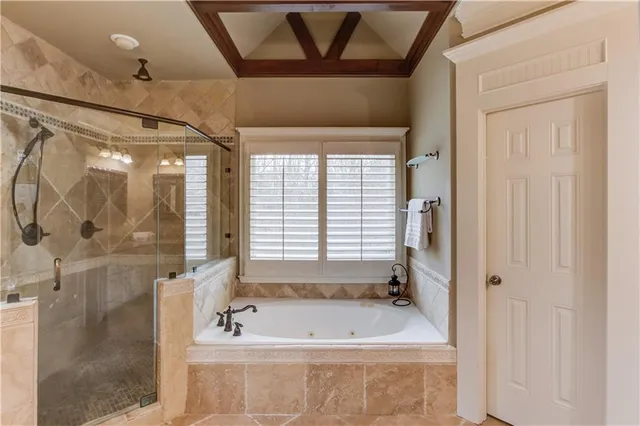 a bathroom with a granite countertop toilet a sink and a mirror