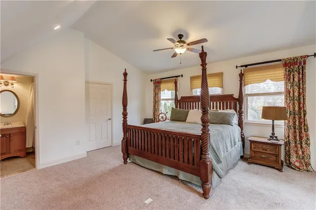 a view of a house with a yard and sitting area