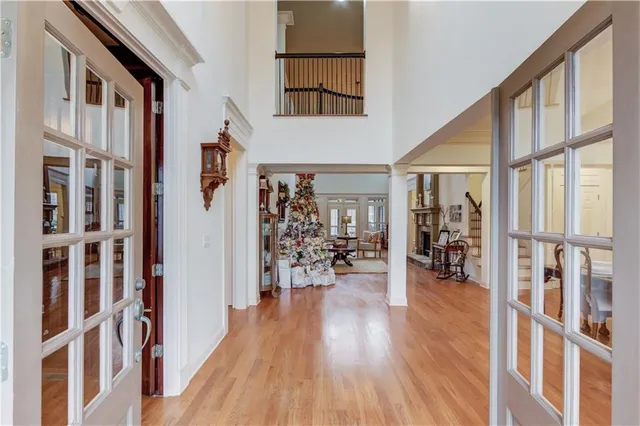a kitchen with granite countertop a table chairs stove a refrigerator and cabinets