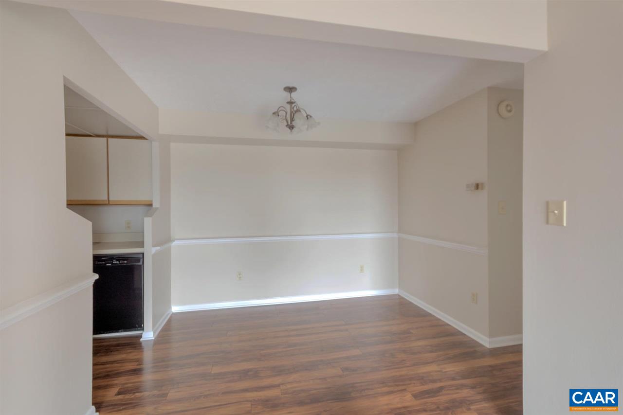 130 Turtle Creek Road, Unit 6 Charlottesville, VA 22901 - Photo 8 of 15 a view of a walk in closet with wooden floor