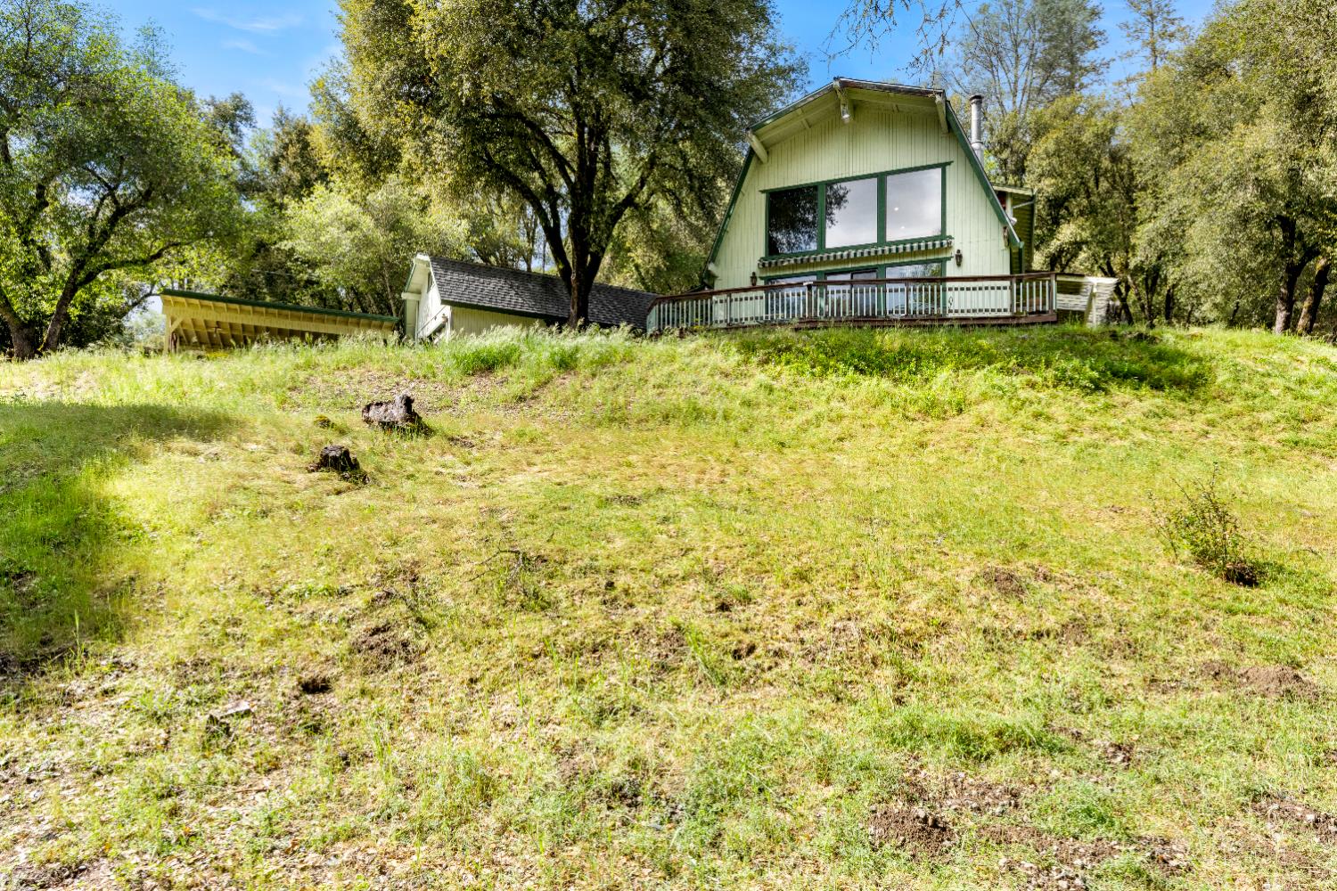 7321 Morning Canyon Road Placerville, CA 95667 - Photo 28 of 39 a backyard of a house with wooden fence and trees