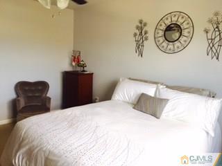 2 Pebble Creek Road Dayton, NJ 08810 - Photo 13 of 22 a bedroom with a bed and a chair