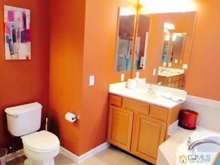 2 Pebble Creek Road Dayton, NJ 08810 - Photo 8 of 22 a bathroom with a sink and a toilet