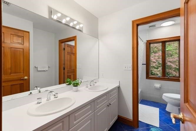 55 Meriam Street Lexington, MA 02420 - Photo 27 of 37 a bathroom with a sink and a mirror