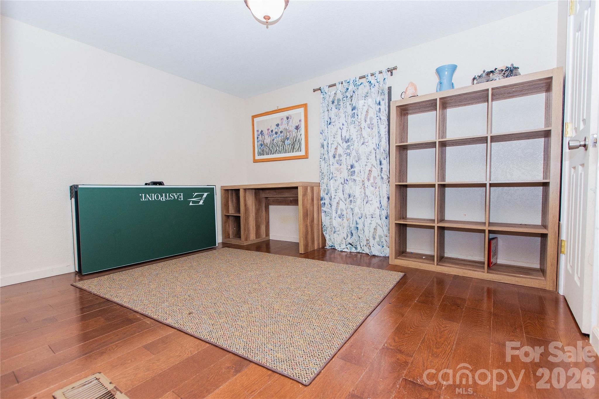 839 Hidden View Loop Marion, NC 28752 - Photo 12 of 32 a bedroom with a bed and a flat screen tv