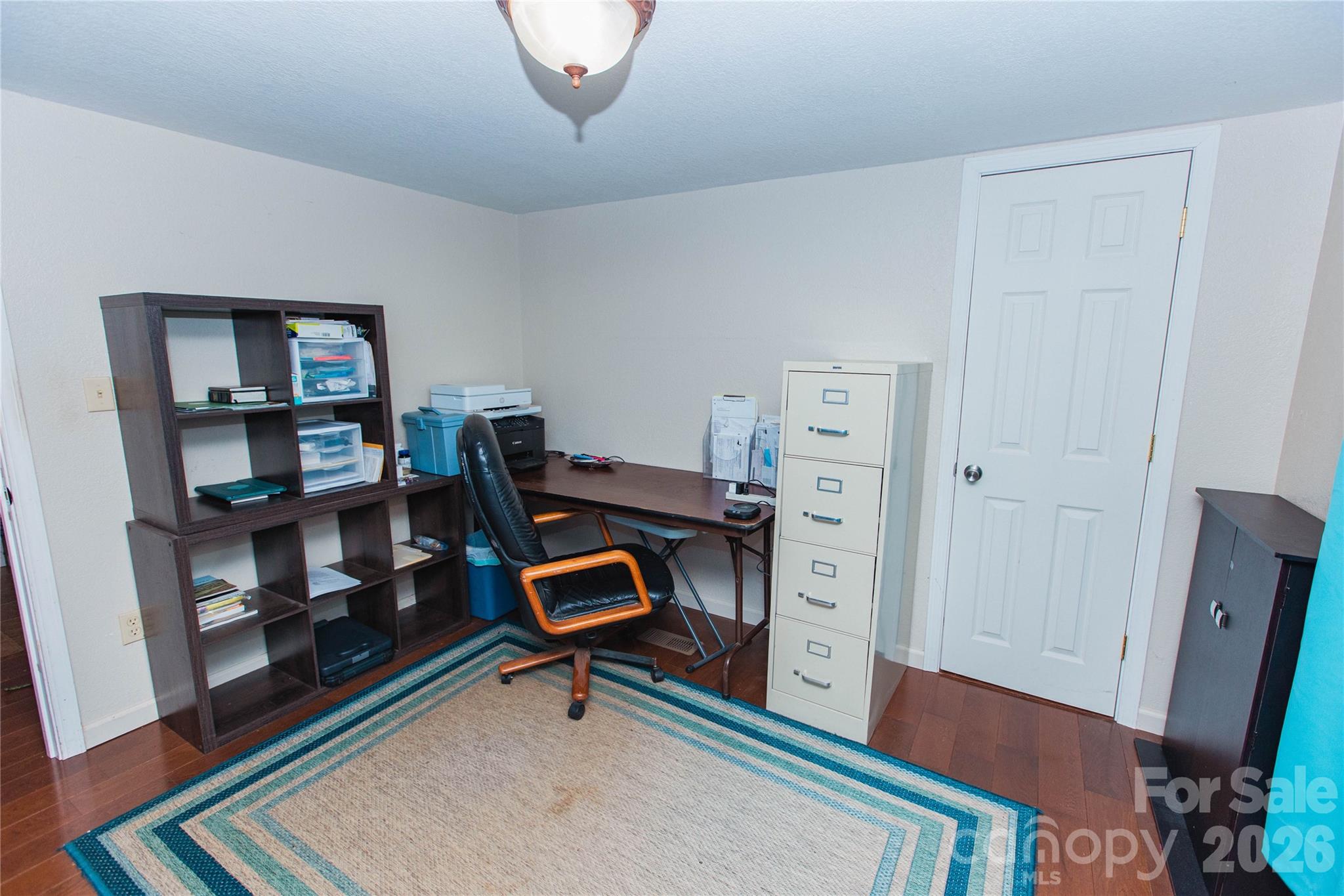 839 Hidden View Loop Marion, NC 28752 - Photo 16 of 32 a room with furniture and a book shelf