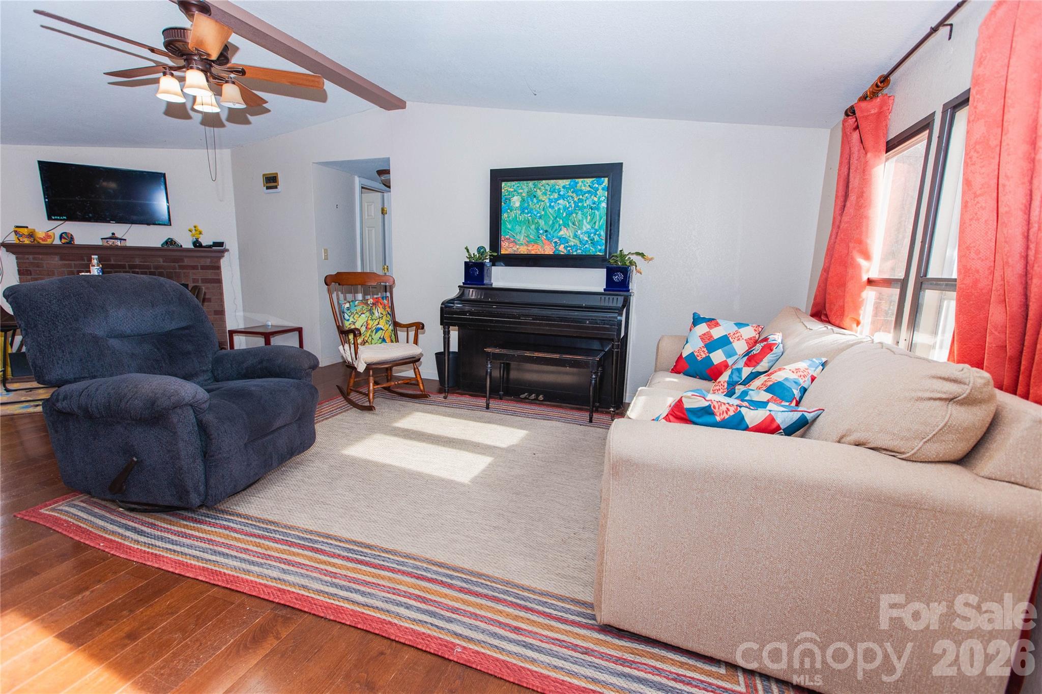 839 Hidden View Loop Marion, NC 28752 - Photo 17 of 32 a living room with furniture and a flat screen tv
