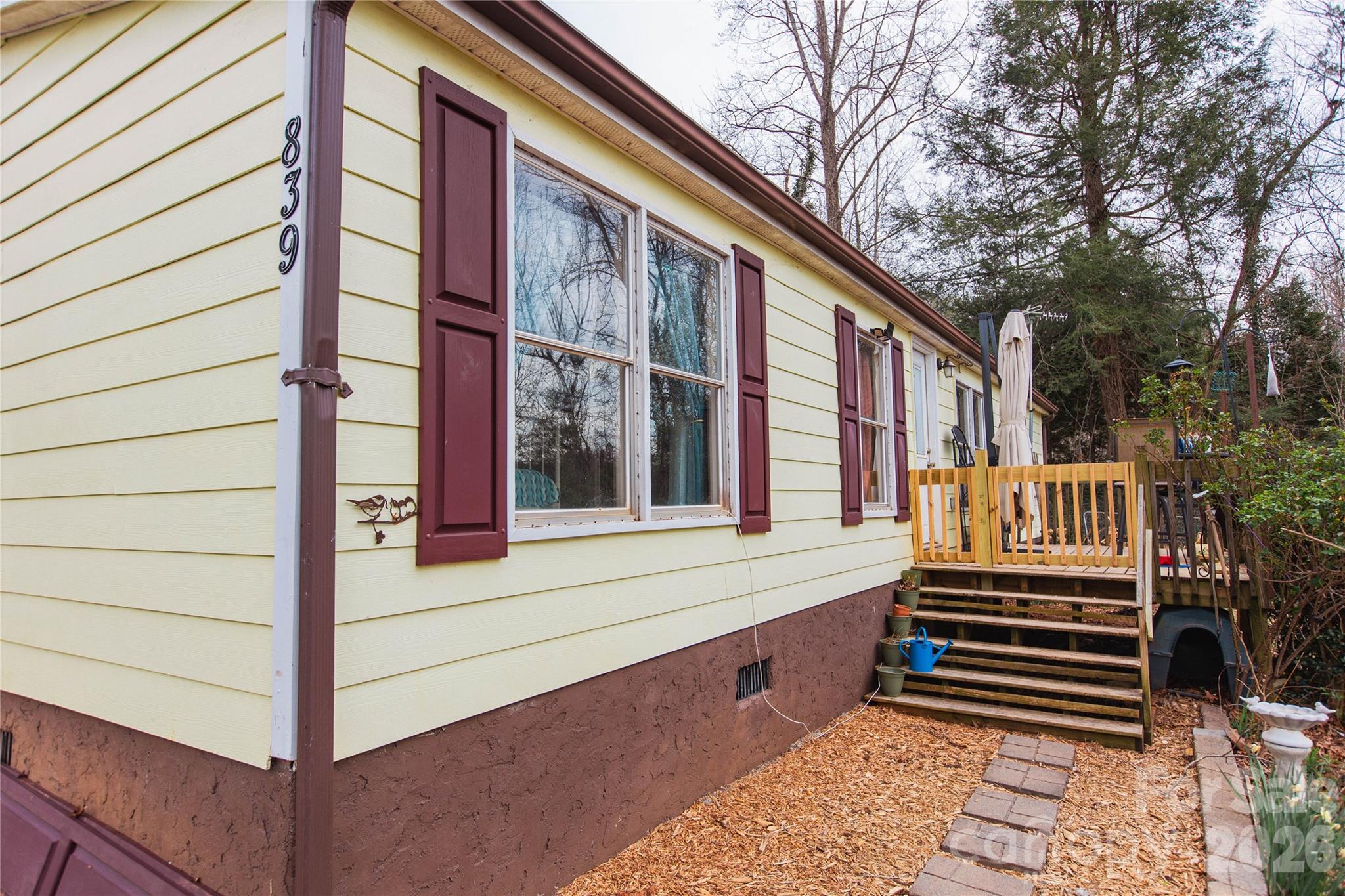839 Hidden View Loop Marion, NC 28752 - Photo 2 of 32 a view of a house with a small deck