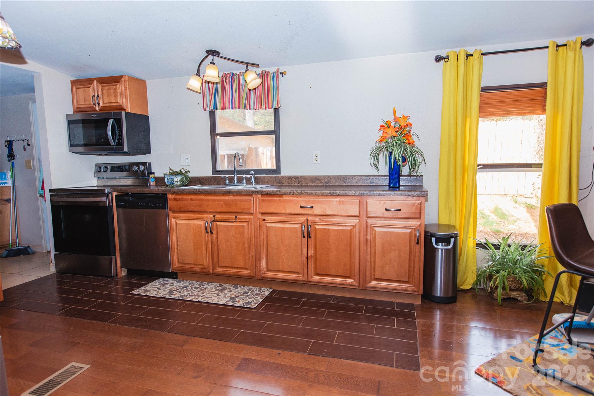 839 Hidden View Loop Marion, NC 28752 - Photo 21 of 32 a kitchen with stainless steel appliances granite countertop a stove a sink and a refrigerator