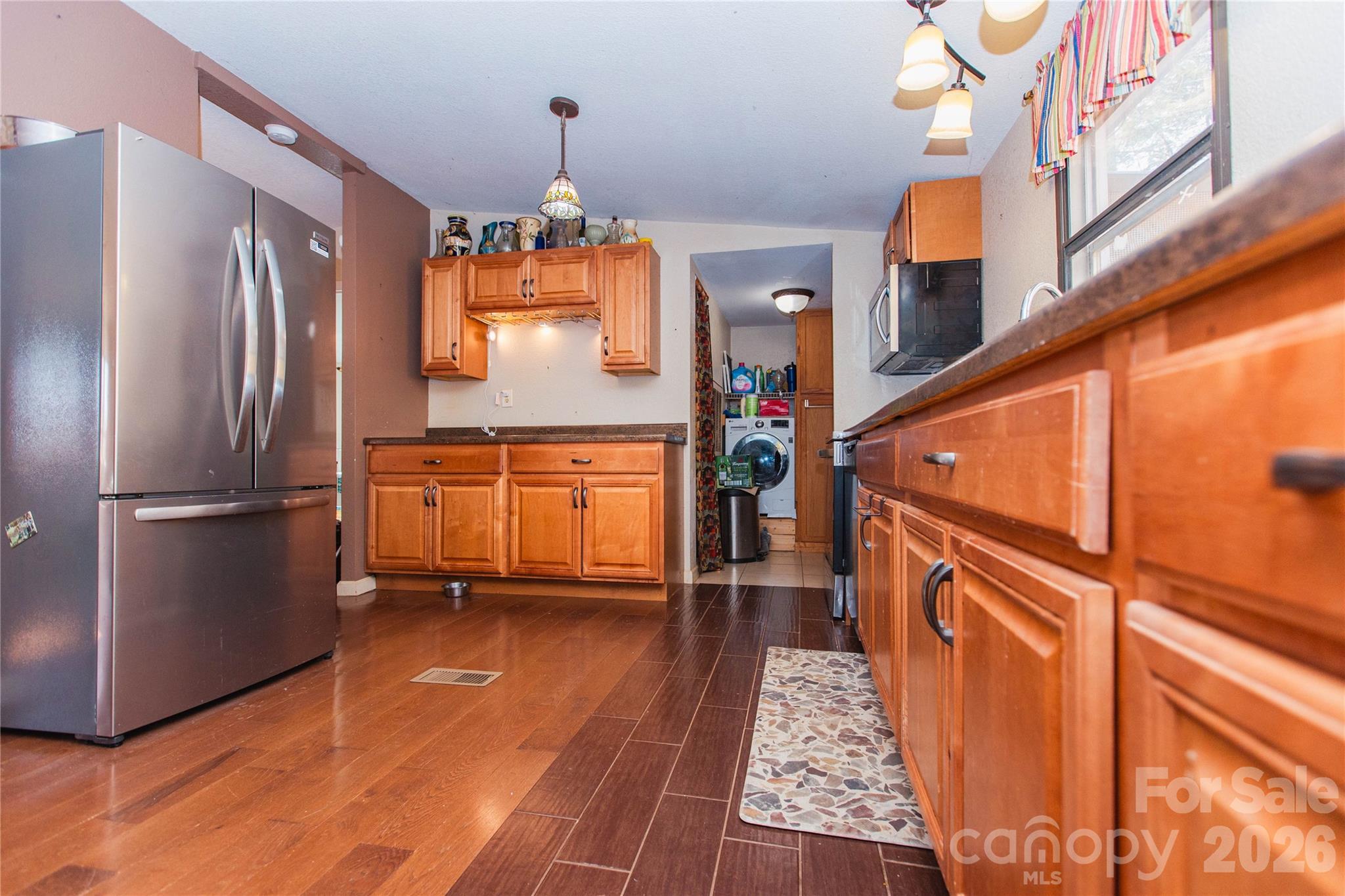839 Hidden View Loop Marion, NC 28752 - Photo 22 of 32 a kitchen with stainless steel appliances granite countertop a refrigerator and a stove