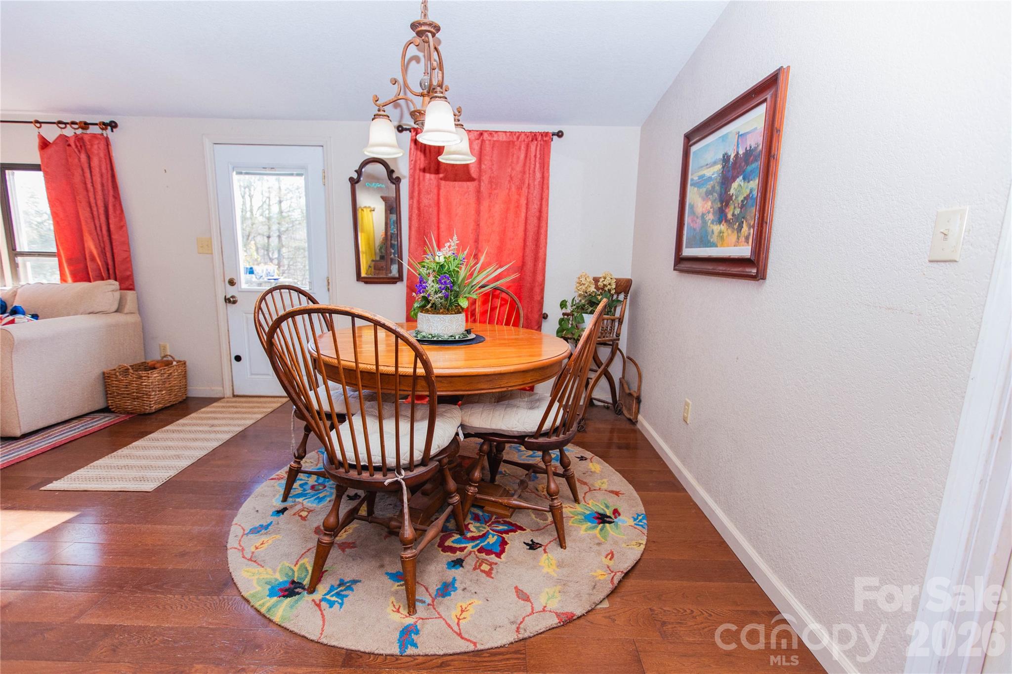 839 Hidden View Loop Marion, NC 28752 - Photo 27 of 32 a view of a dining room with furniture window and wooden floor