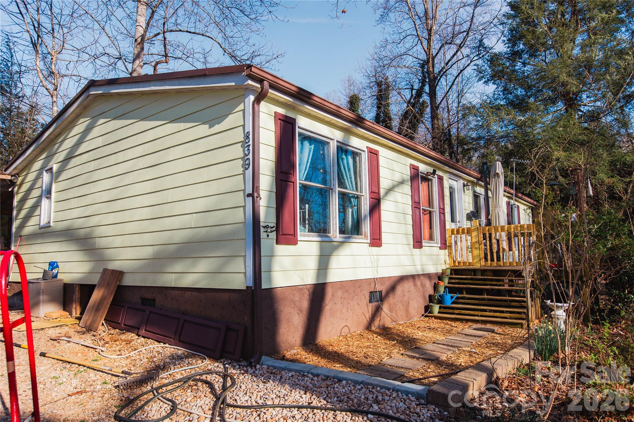 839 Hidden View Loop Marion, NC 28752 - Photo 31 of 32 a view of backyard with large trees and wooden fence