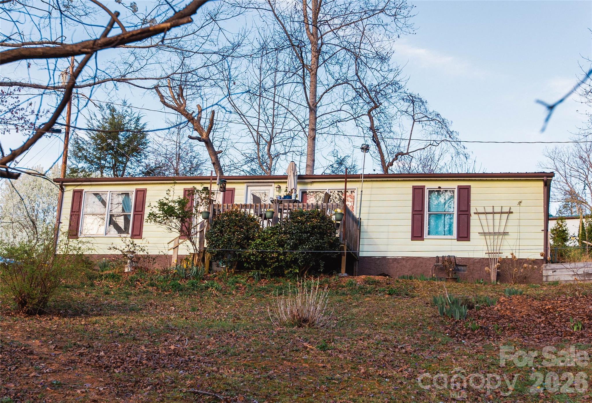 839 Hidden View Loop Marion, NC 28752 - Photo 32 of 32 a backyard of a house with lots of green space