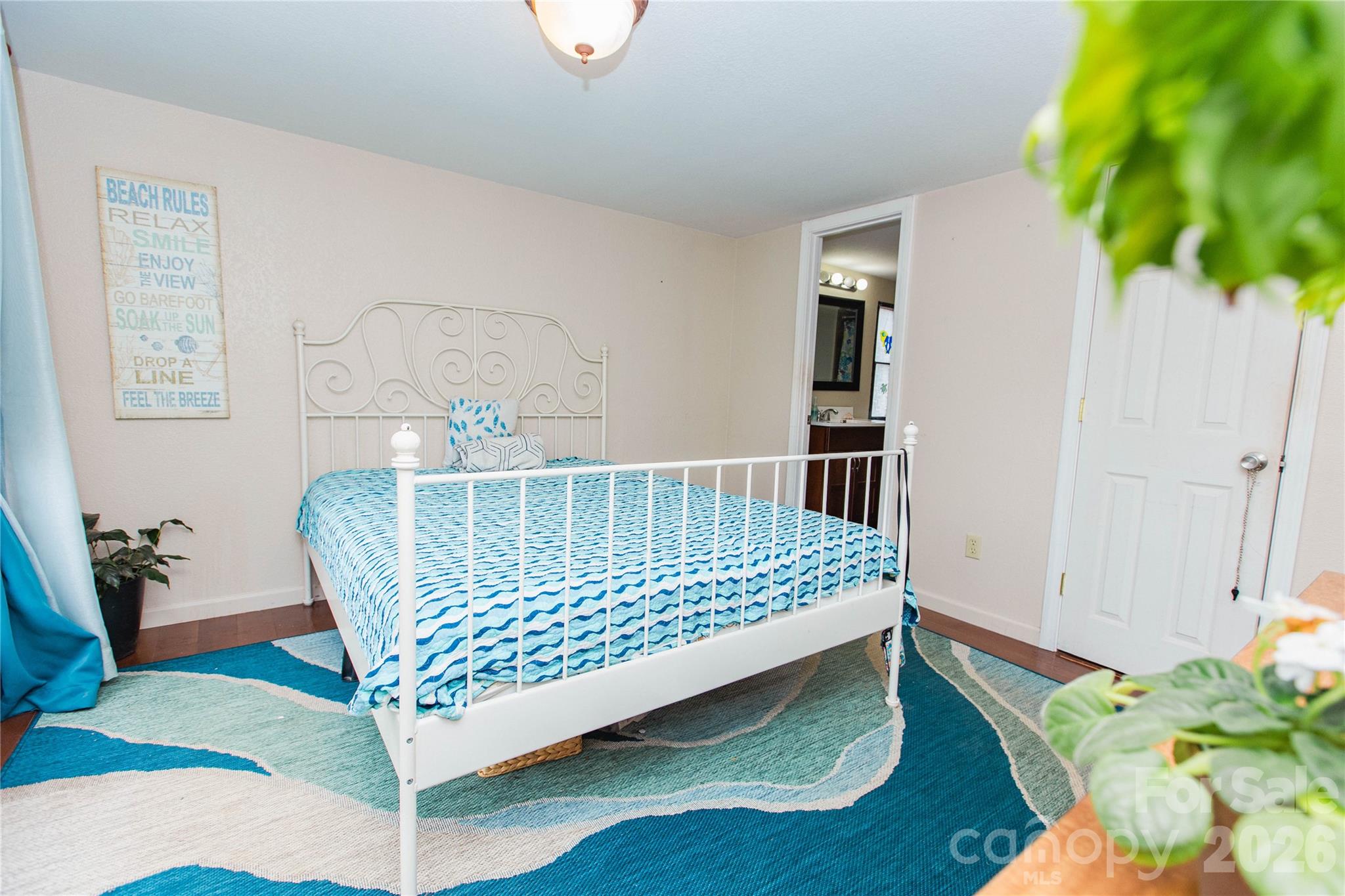 839 Hidden View Loop Marion, NC 28752 - Photo 5 of 32 a bed sitting in a bedroom next to a window