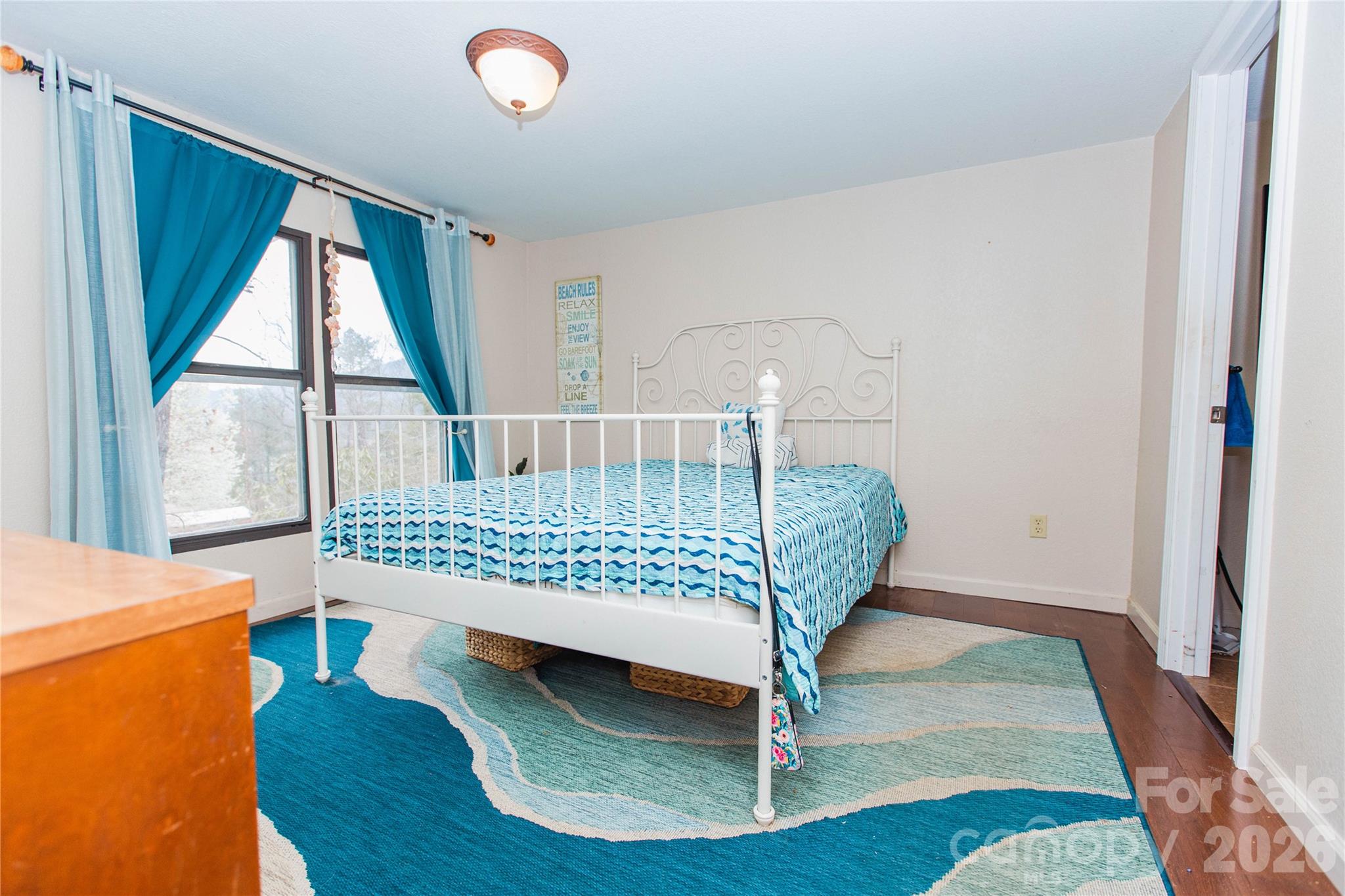 839 Hidden View Loop Marion, NC 28752 - Photo 6 of 32 a bedroom with a bed and a window