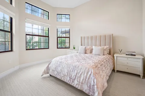 a view of a livingroom with workspace and a window