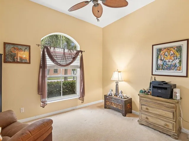a bedroom with furniture and a window
