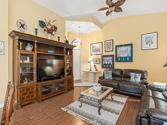 a living room with furniture and a flat screen tv