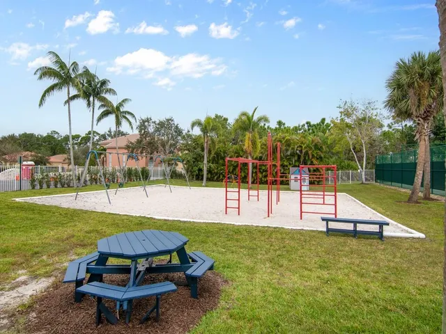 a swimming pool with outdoor seating and yard