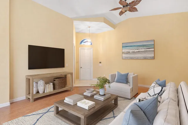 a living room with furniture and a flat screen tv