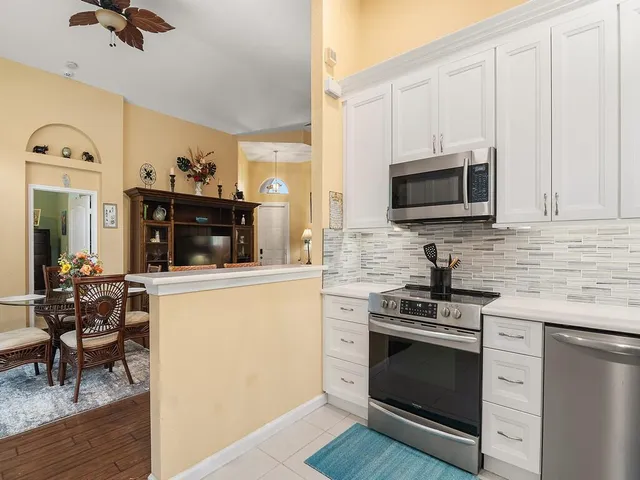 a kitchen with a stove and a microwave