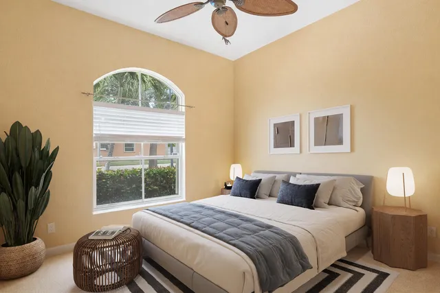 a bedroom with a bed and a window