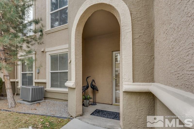 9050 Double R Boulevard, Unit 724 Reno, NV 89511 - Photo 14 of 18 a view of a brick house with outdoor space