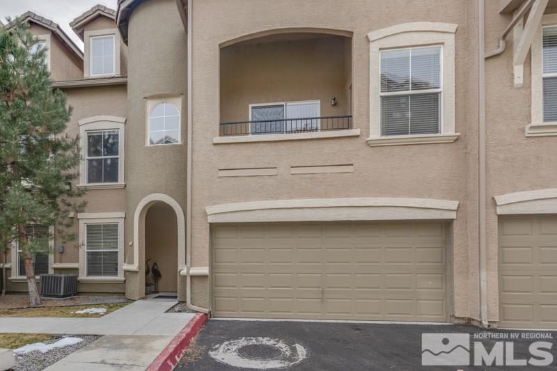 9050 Double R Boulevard, Unit 724 Reno, NV 89511 - Photo 15 of 18 a front view of a house with parking