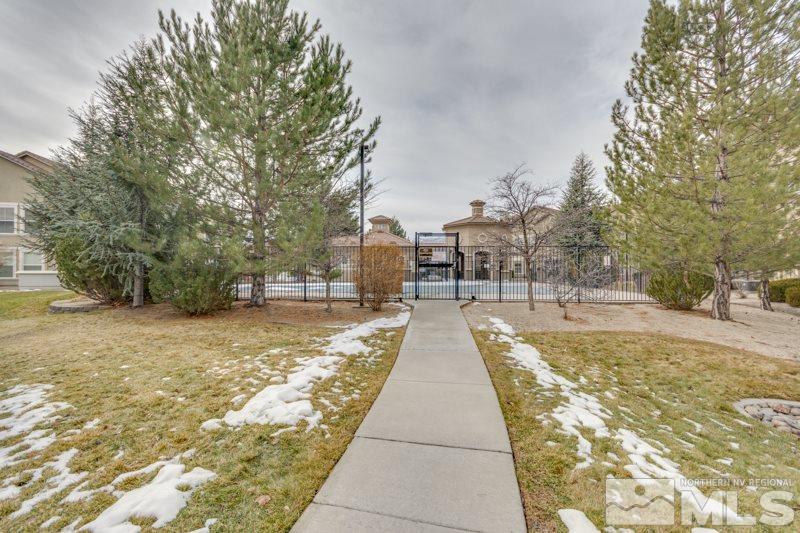 9050 Double R Boulevard, Unit 724 Reno, NV 89511 - Photo 17 of 18 a swimming pool with outdoor seating and yard