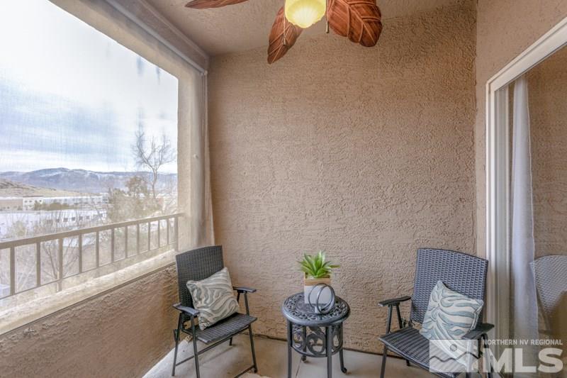 9050 Double R Boulevard, Unit 724 Reno, NV 89511 - Photo 6 of 18 a view of a balcony with chairs