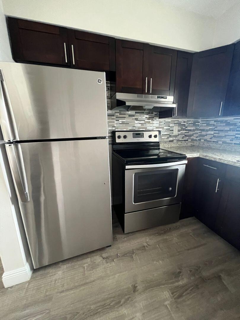 480 West Camino Real, Unit 31 Boca Raton, FL 33432 - Photo 2 of 22 a white refrigerator freezer sitting in a kitchen