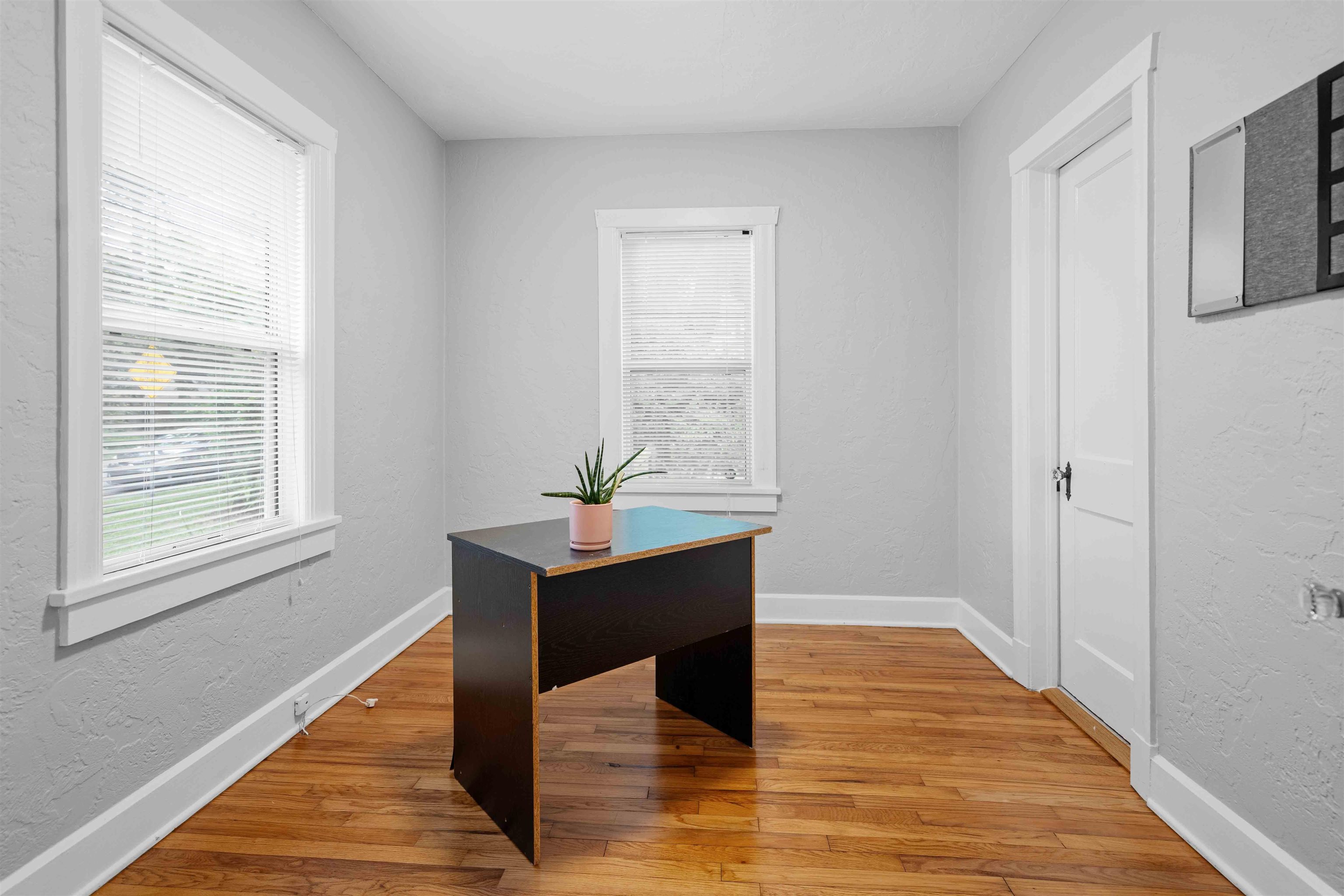 716 Northeast 10th Avenue Gainesville, FL 32601 - Photo 14 of 29 a view of a room with wooden floor windows and cabinet