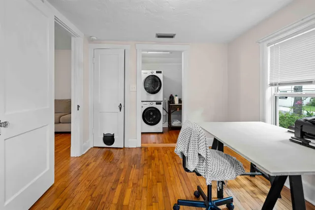 a bedroom with a bed and a table in it