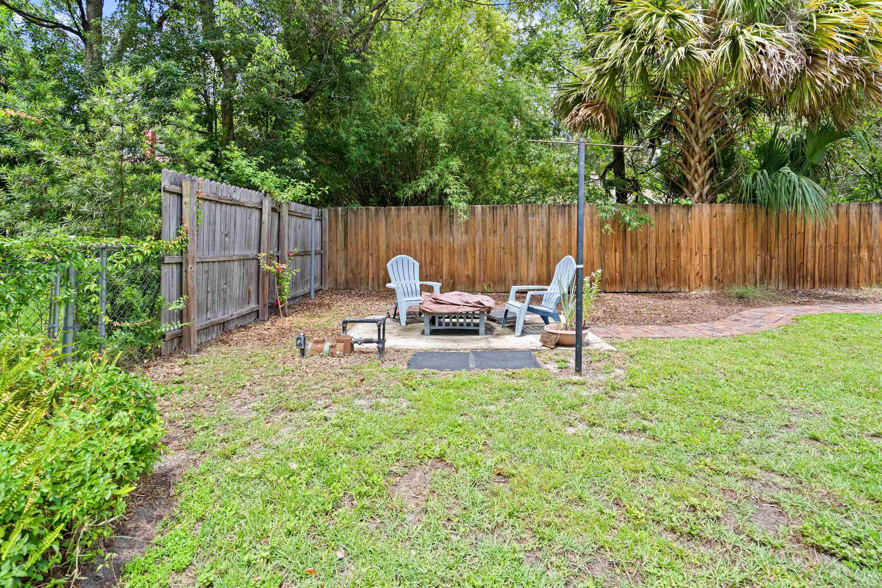 716 Northeast 10th Avenue Gainesville, FL 32601 - Photo 21 of 29 a backyard view with a seating space