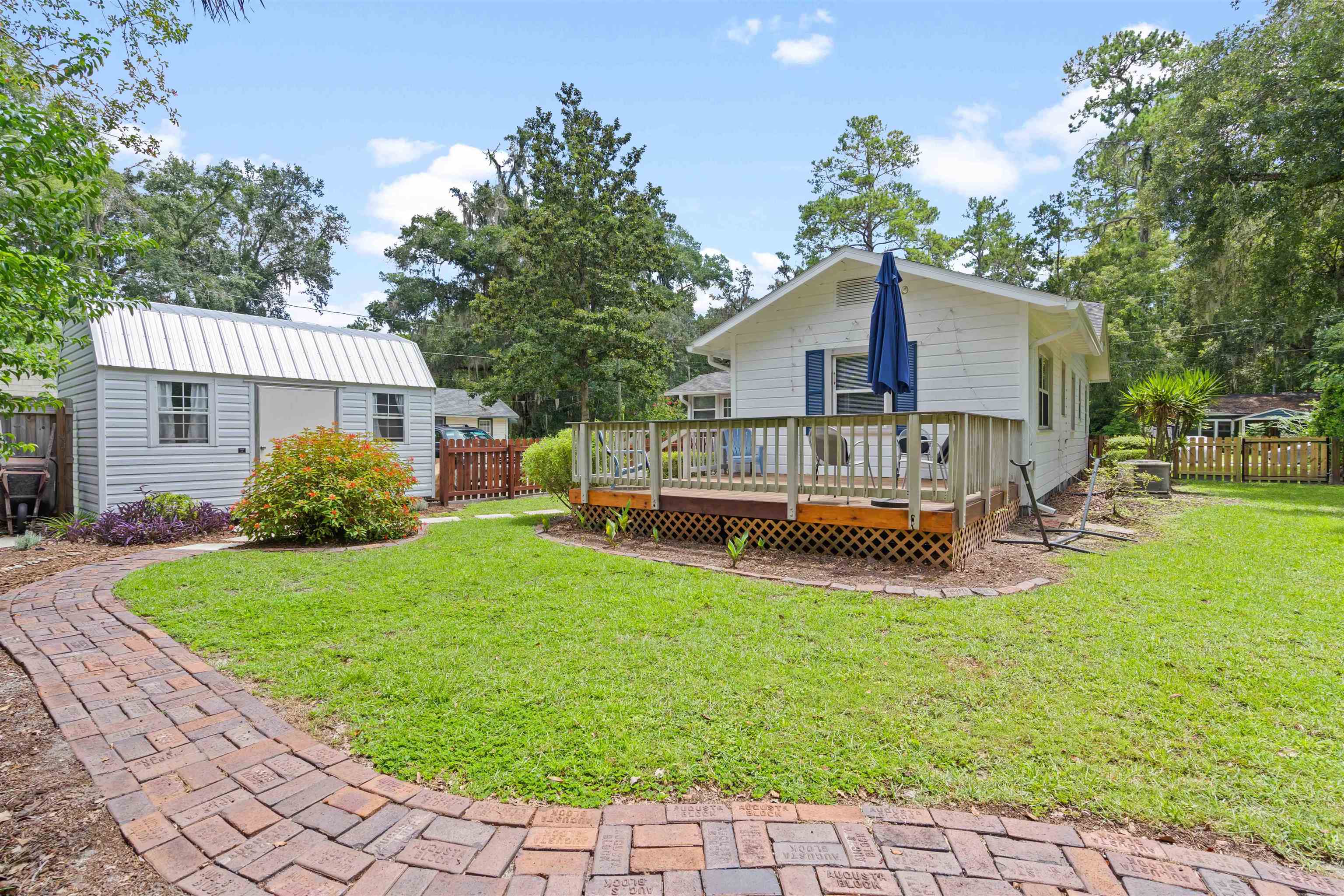 716 Northeast 10th Avenue Gainesville, FL 32601 - Photo 28 of 29 a view of a house with a yard porch and sitting area