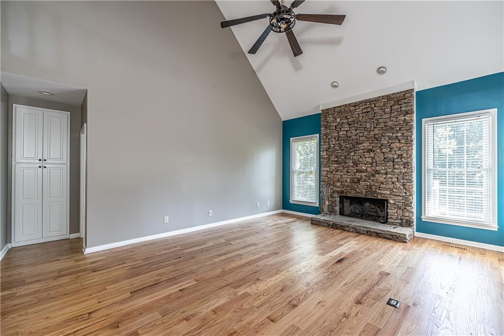 113 Warwick Way Rome, GA 30161 - Photo 8 of 49 wooden floor fireplace and windows in an empty room