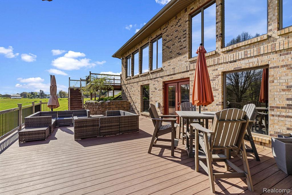 8742 Hyne Road Brighton, MI 48114 - Photo 10 of 65 Deck featuring outdoor lounge area and french doors