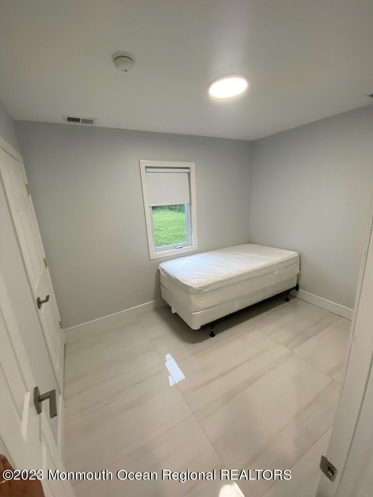 258 Norgrove Avenue Long Branch, NJ 07740 - Photo 16 of 16 a bedroom with a bed and a window