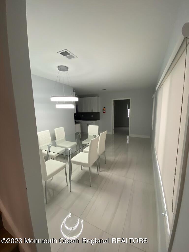 258 Norgrove Avenue Long Branch, NJ 07740 - Photo 7 of 16 a living room with furniture and a rug