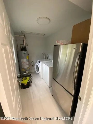 a kitchen with a refrigerator and a stove