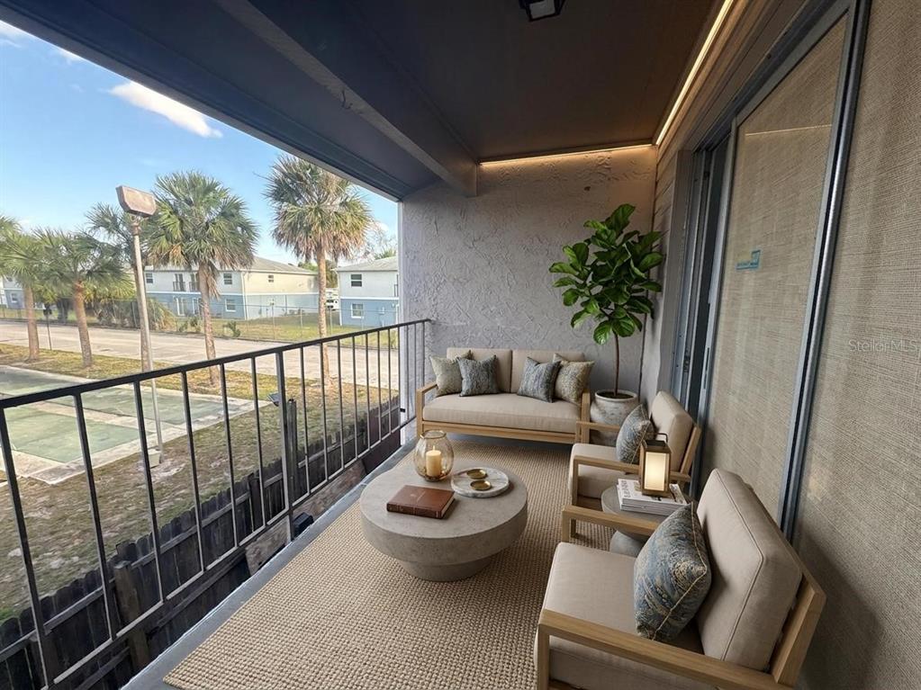 4033 Henley Road, Unit 1707 Orlando, FL 32839 - Photo 11 of 66 a outdoor living space with furniture and garden view
