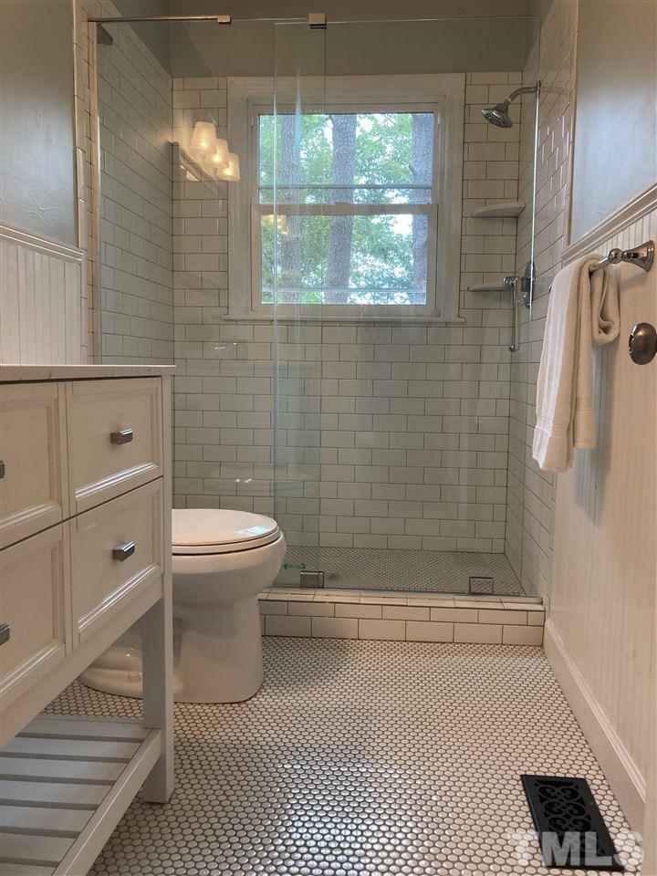 2433 Stevens Road Raleigh, NC 27610 - Photo 12 of 15 a bathroom with a toilet and a shower