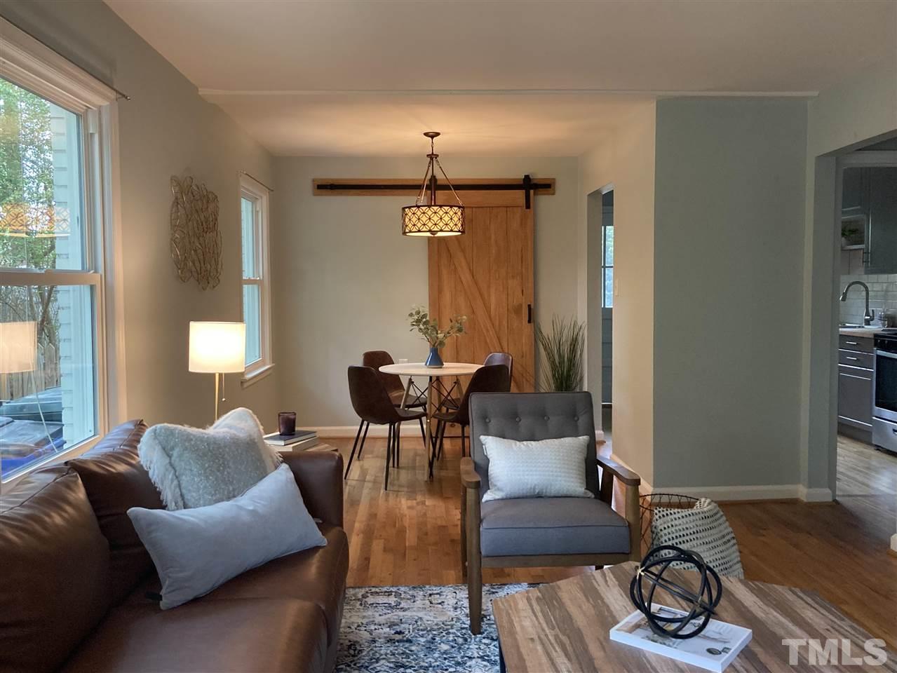 2433 Stevens Road Raleigh, NC 27610 - Photo 4 of 15 a living room with furniture and wooden floor