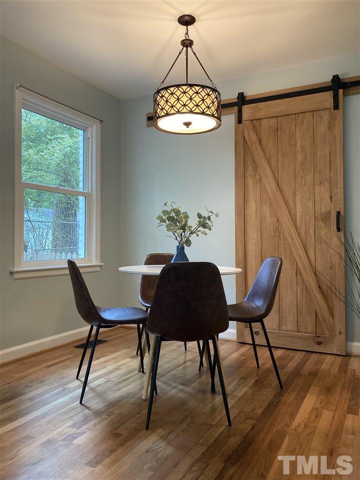 2433 Stevens Road Raleigh, NC 27610 - Photo 6 of 15 a table and chairs in a dining room with a window