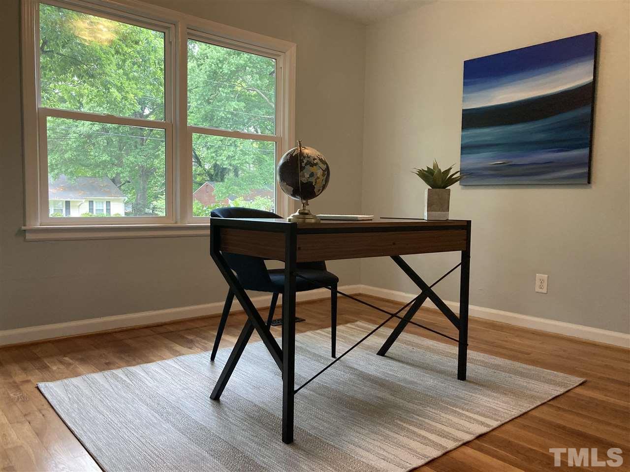 2433 Stevens Road Raleigh, NC 27610 - Photo 10 of 15 a view of a workspace room with wooden floor and windows