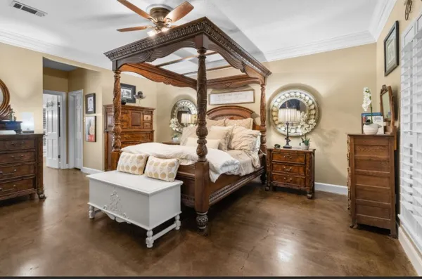 a en suite bathroom with a granite countertop sink a large mirror and a shower
