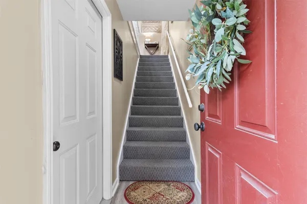 a bathroom with a sink toilet and a mirror