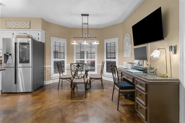 a view of a livingroom with furniture window and wooden floor